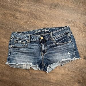 Dark to medium wash ripped and cut off denim shorts